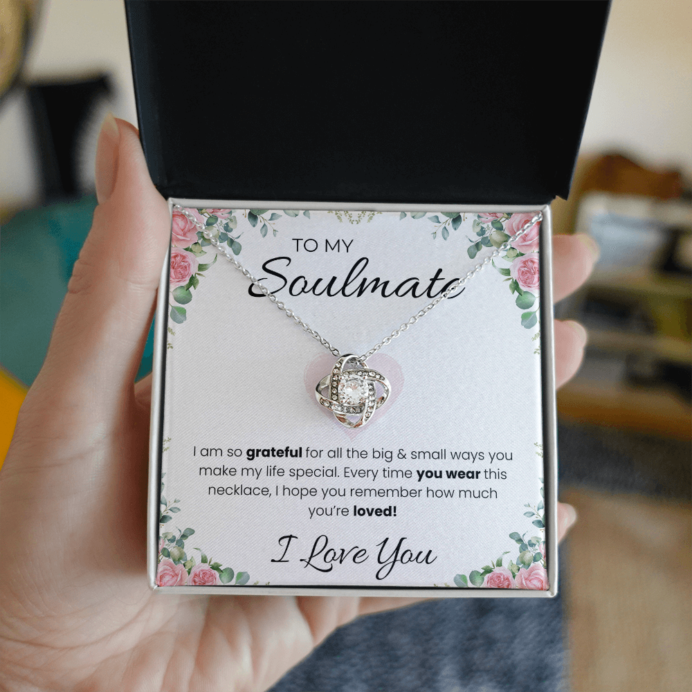 Love Knot pendant necklace for soulmate, worn, close-up on the pendant — Eloura